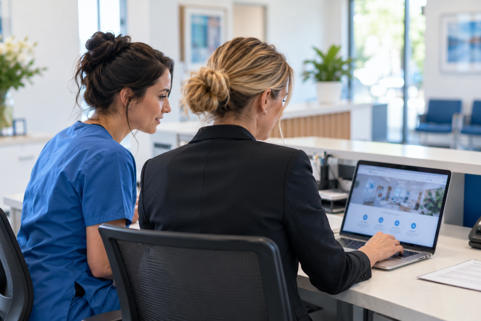 Clinic operations manager and colleague reviewing a practice website at reception (AI-generated concept)